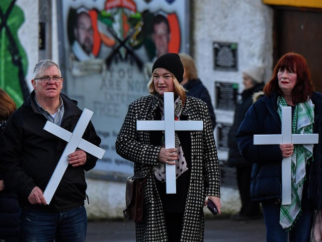 Relatives carry white crosses during the annual Bloody Sunday march. Photo: George Sweeney