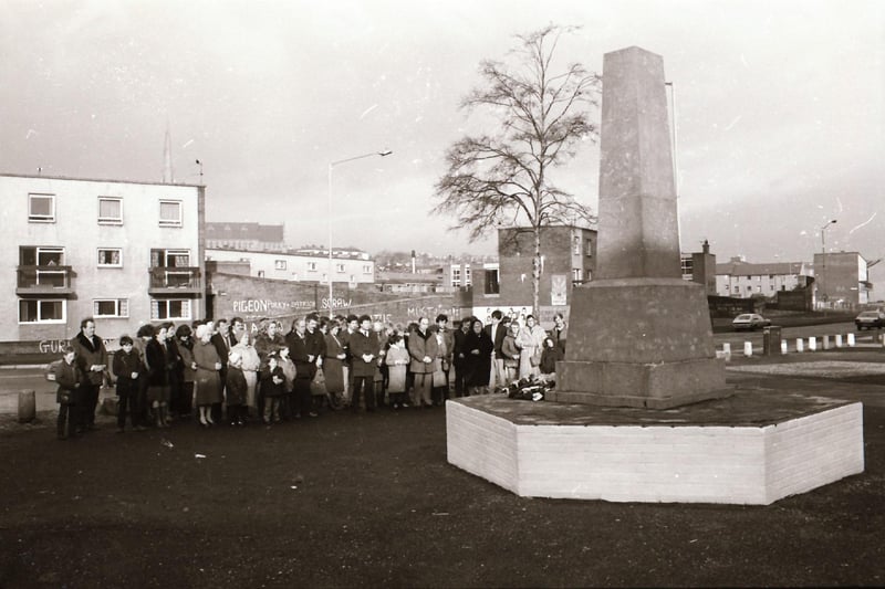 Family members gather at the Bloody Sunday monument on Rossville Street in January 1984.