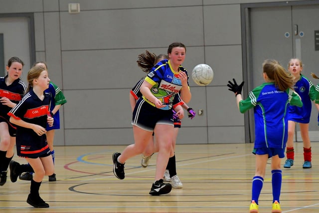 Action from Sacred Heart (2) against Steelstown in the Derry City Primary School Girls’ Indoor Gaelic Finals Day at the Foyle Arena on Friday afternoon. Photo: George Sweeney. DER2308GS –120