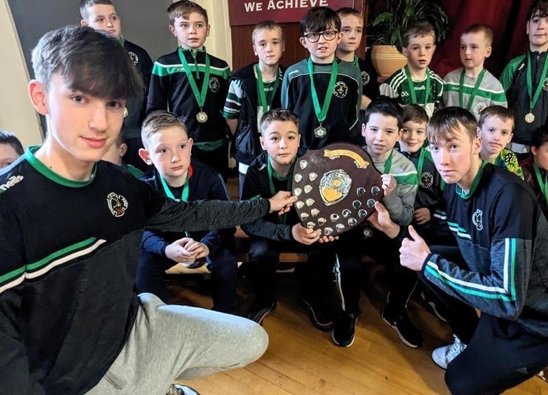 Shea Doherty and Oran O'Donghaile present awards to these youngsters at the presentation evening.
