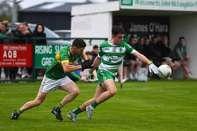 Faughanvale's  Jude Bryson evades a tackle from Foreglen's  Eoghan Duffy. Photo: George Sweeney