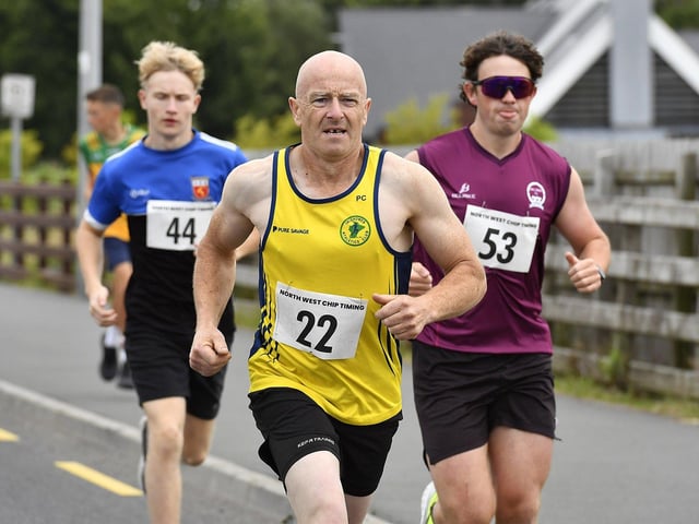 Inishowen Athletic Club’s Philip Callaghan (22) competes in the Muff Feile 5K on Saturday morning. Photo: George Sweeney