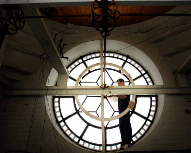 Craig Park, Ritchie's Clockmakers, Edinburgh, performs essential maintenance on Derry's Guildhall Clock in 2007. Photo: Stephen Latimer