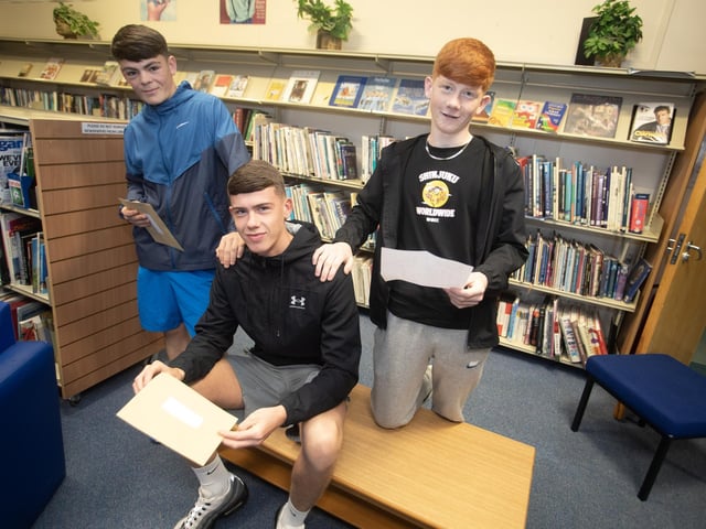 St. Joseph's GCSE students Cormac McDaid, Niall O'Kane and Liam Campbell check out their results on Thursday. (Photos: Jim McCafferty Photography)