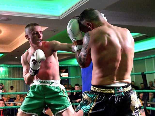 Rathmor Warriors’ Jake Mooney (left) defeated Dennis Lafferty, SMAA, to win the Lightweight LK Irish Title, on Saturday evening last, in the Everglades Hotel. Photo: George Sweeney. DER2312GS – 70