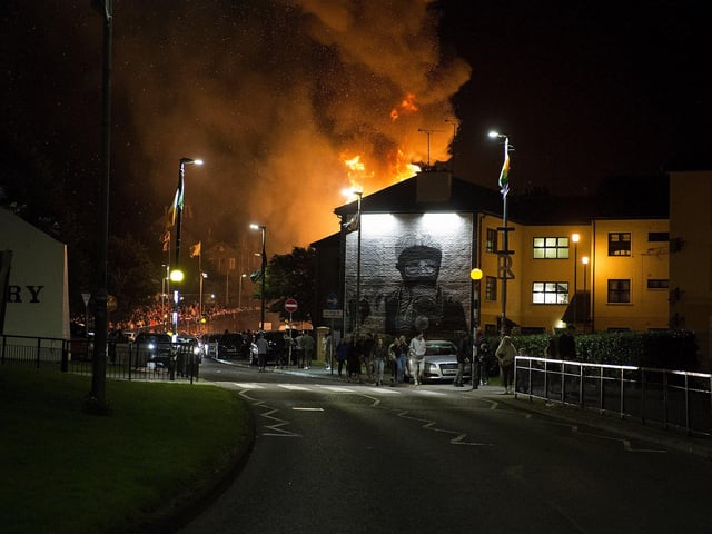 Flames from the Bogside bonfire as seen from Rossville Street on Thursday night. Photo: George Sweeney
