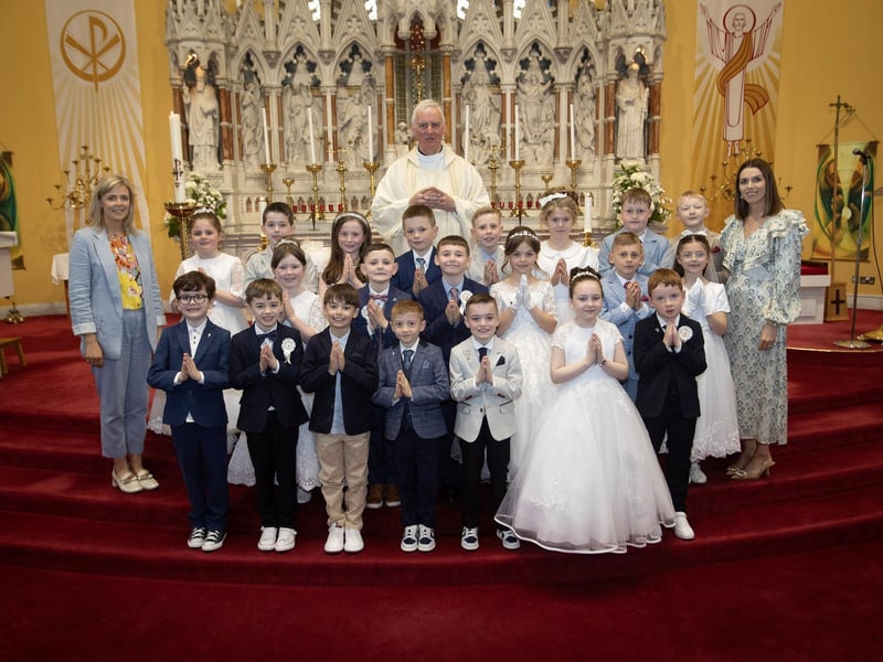 Children from Good Shepherd Primary School who received the Sacrament of First Holy Communion from Fr. Michael Canny at St. Columba's Church, Waterside on Friday last. Included are Mrs. Suzann McCafferty, Principal and Mrs. Robyn Chambers, class teacher. (Photos: Jim McCafferty Photography)