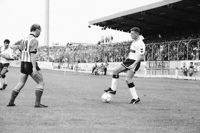 Paul Gascoigne under the close attention of Paul McGee.