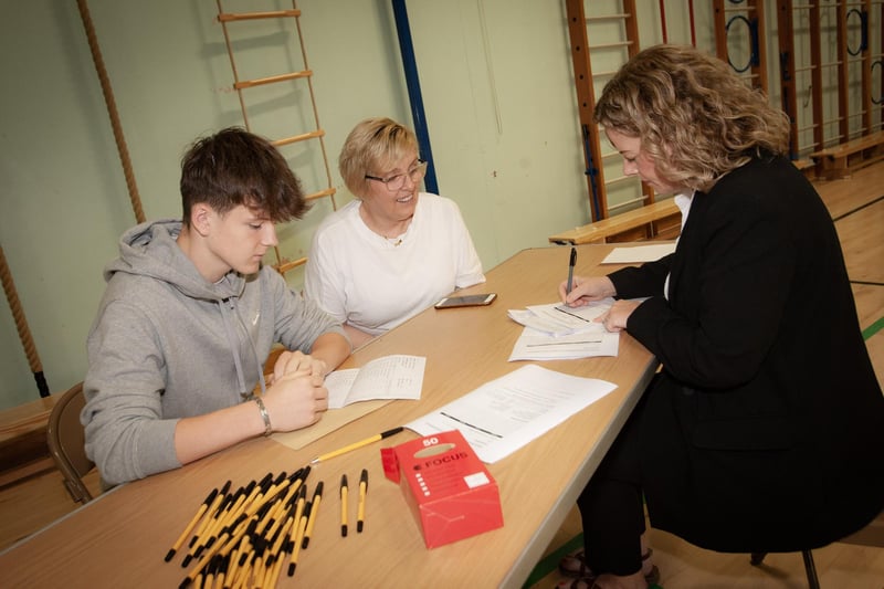 Mrs. Fiona Harigan, Vice Principal, St. Joseph's Boys' School discussing options with GCSE student Callum Watkins and his mum Ann, after receiving his results on Thursday. (Photos: Jim McCafferty Photography)