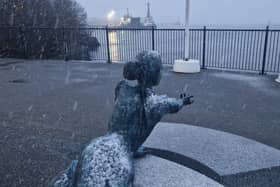 Snow falling by the River Foyle.
