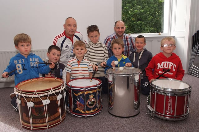 Derek Moore and Gavin Bond, tutors, pictured with some of the youngsters who enjoyed the drumming workshop which was held by the Waterside Bands Forum in St. Columb's Park House as part of Fleadh Cheoil Na nEireann. INLS3413-119KM