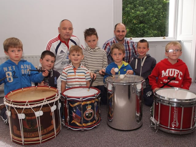 Derek Moore and Gavin Bond, tutors, pictured with some of the youngsters who enjoyed the drumming workshop which was held by the Waterside Bands Forum in St. Columb's Park House as part of Fleadh Cheoil Na nEireann. INLS3413-119KM