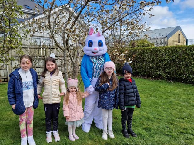 The Williamson and Kelly children with the Easter Bunny at the Barrack Hill Easter Trail on Monday.