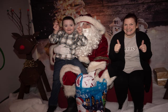 Its a thumbs up from Callum and mum Patricia at the Santa Visit in FDST's headquarters on Monday night.