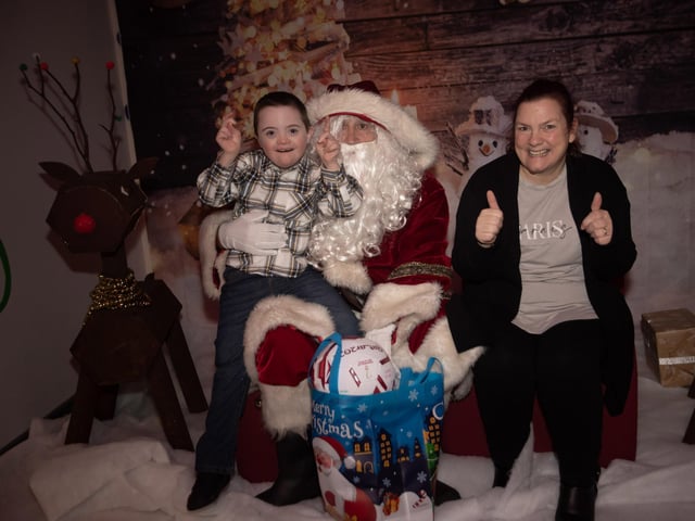 Its a thumbs up from Callum and mum Patricia at the Santa Visit in FDST's headquarters on Monday night.
