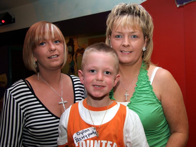 Dylan smiles for the camera with his aunts, Sally and Siobhan at Bananas 0567JML : Parties and celebrations June 2006: Dylan McDaid.