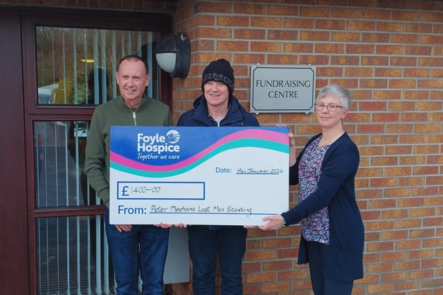 In memory of Cathy - Peter Meehan (Cathy’s Brother) and Paddy McGonigle (Brother-in-law) presenting a cheque for £1400 to June McAuley, Foyle Hospice, proceeds from a Last Man Standing Competition held in memory of Cathy McGonigle.