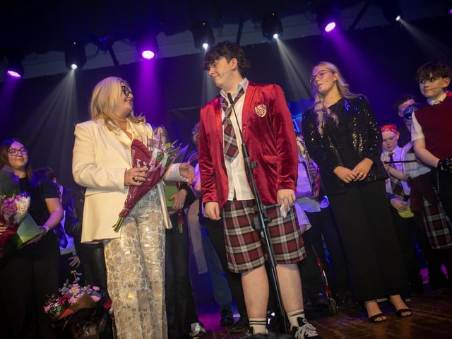 School Princpal Mrs. CIara Deane is presented with a bouquet of flowers on Thursday night.