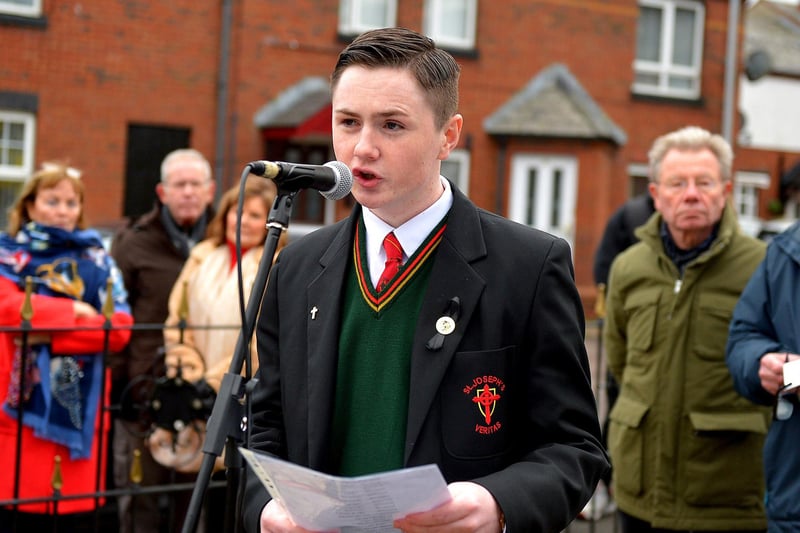 Evan Curran, a relative of William Nash, reads the names of the dead and wounded at the Bloody Sunday monument at Joseph's Place on Monday afternoon where a one minute silence was observed on the 51st anniversary of the Bloody Sunday massacre. Photo: George Sweeney. DER2306GS 46