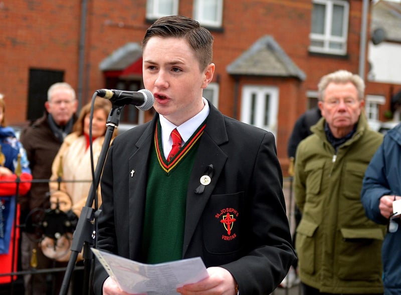 Evan Curran, a relative of William Nash, reads the names of the dead and wounded at the Bloody Sunday monument at Joseph's Place on Monday afternoon where a one minute silence was observed on the 51st anniversary of the Bloody Sunday massacre. Photo: George Sweeney. DER2306GS 46