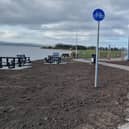 The picnic overlooking beside Lough Foyle with a covered cycle rack at Three Trees, Quigley Point.