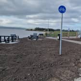 The picnic overlooking beside Lough Foyle with a covered cycle rack at Three Trees, Quigley Point.