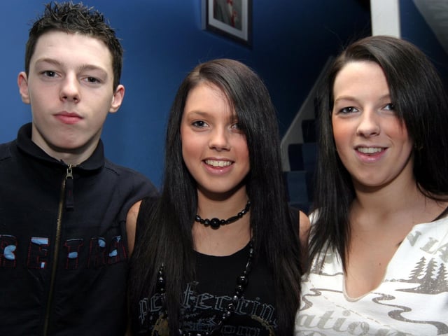Nicole poses for the photographer with sister Danielle and brother Sean. 0055/JML