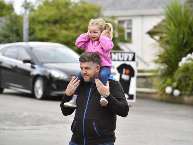 Spectators at the Muff Feile opening parade makes on Friday evening. Photo: George Sweeney