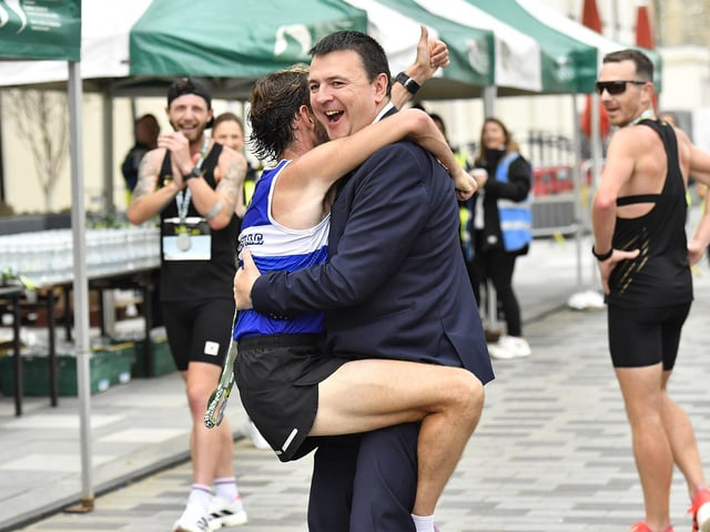 Finn Valley’s John Joe Doherty celebrates finishing third, in the 2025 Waterside Half, with Mayor Ruairí McHugh. Photo: George Sweeney