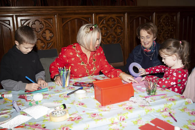 The Mayor Sandra Duffy gets some lessons in making Christmas cards during the Arts and Crafts workshop at the Mayor's Magical Christmas Experience at the Guildhall on Saturday.:.