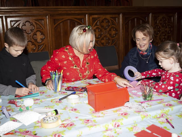 The Mayor Sandra Duffy gets some lessons in making Christmas cards during the Arts and Crafts workshop at the Mayor's Magical Christmas Experience at the Guildhall on Saturday.:.