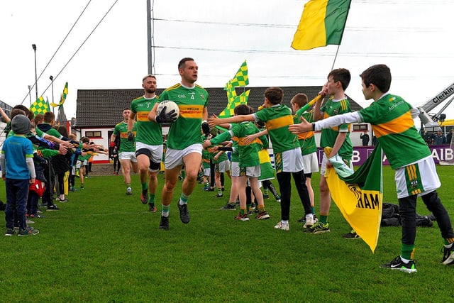 Glen players run onto the pitch at Celtic Park for their  Ulster Senior Club Championship quarter- final against Errigal Ciaran on Sunday afternoon last. Photo: George Sweeney.  DER2246GS – 026