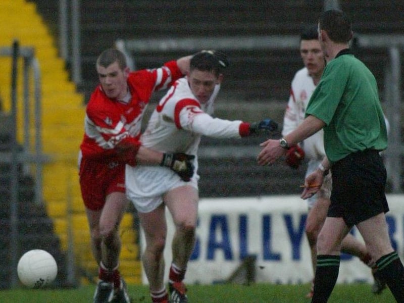 Derry half-back Francis McEldowney battles with Tyrone's Mickey Coleman in Healy Park in January 2004.