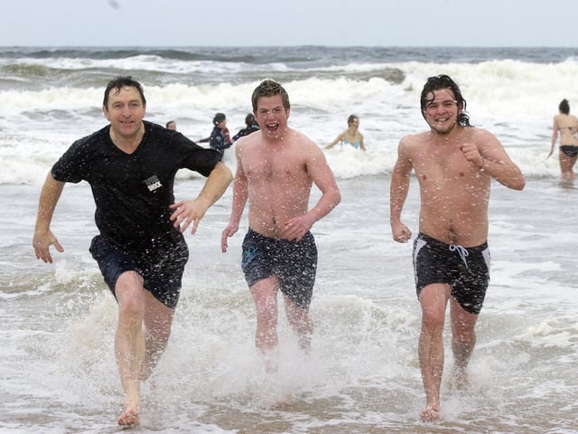From left, Cormac, Conor, and Mark Skinnador. (0301PG12) : Culdaff New Year's Day Swim in 2006.