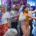 Staff, residents and families enjoying a dance