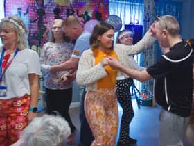 Staff, residents and families enjoying a dance