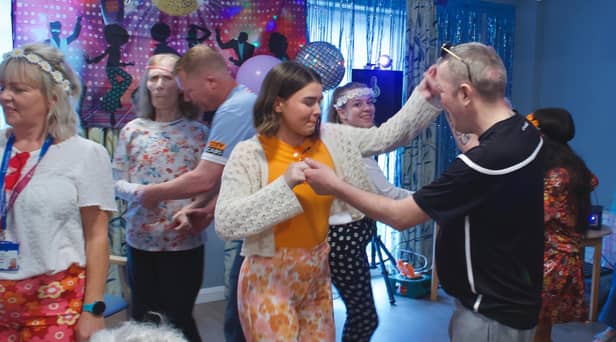 Staff, residents and families enjoying a dance
