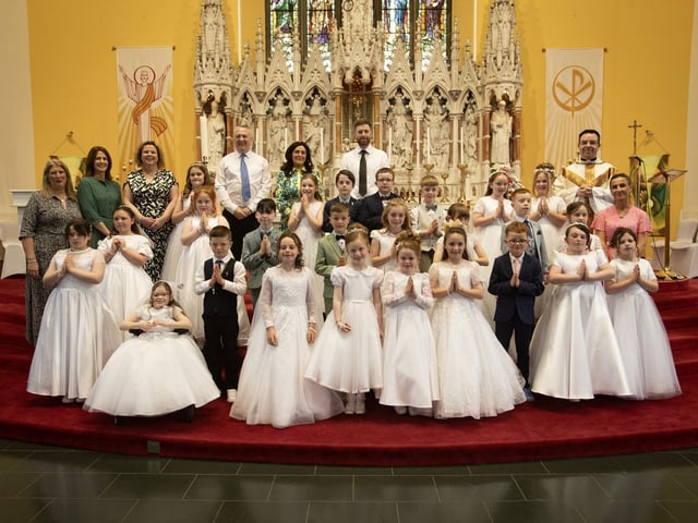 Pupils from Oakgrove PS, Lisnagelvin PS and Ebrington PS who received the Sacrament of First Holy Communion from Fr. Patrick Lagan at St. Columb's Church, Chapel Road on Thursday afternoon last. Included are principals and teachers from the three schools. (Photo: Jim McCafferty Photography)