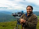 Wildlife cameraman Hamza Yassin stands with his camera in the Cairngorms National Park