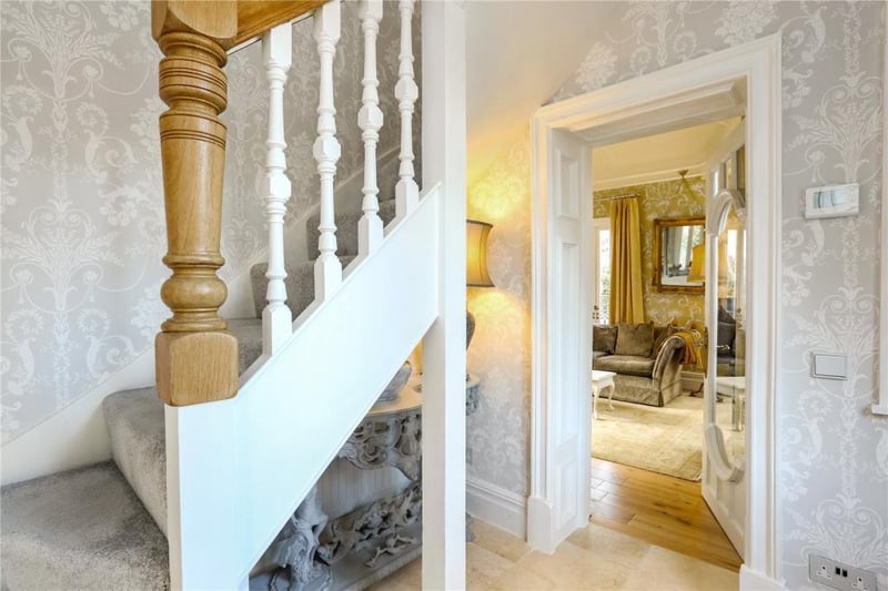 The property is entered through reclaimed glass doors to a light and airy hallway.