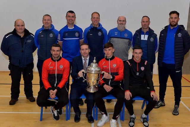 Derry City players Michael Duffy, Liam Mullan and Jordon McEneff pictured with staff St Columb's College during a visit to the school, with the FAI Cup, on Monday. Photo: George Sweeney. DER2247GS  30
