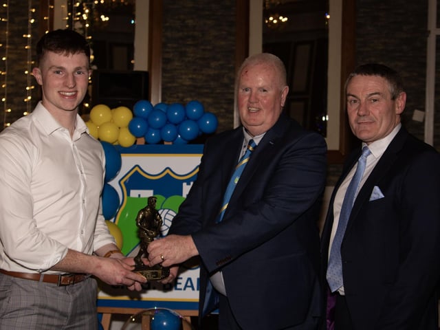 Conor Gartland - U21 Football - Player of the Year 2024 receives his trophy from Liam Gallagher, Club Chair. On right is Mr. Ciaran McLaughlin, Outgoing Ulster President, GAA. (Photo: Jim McCafferty)