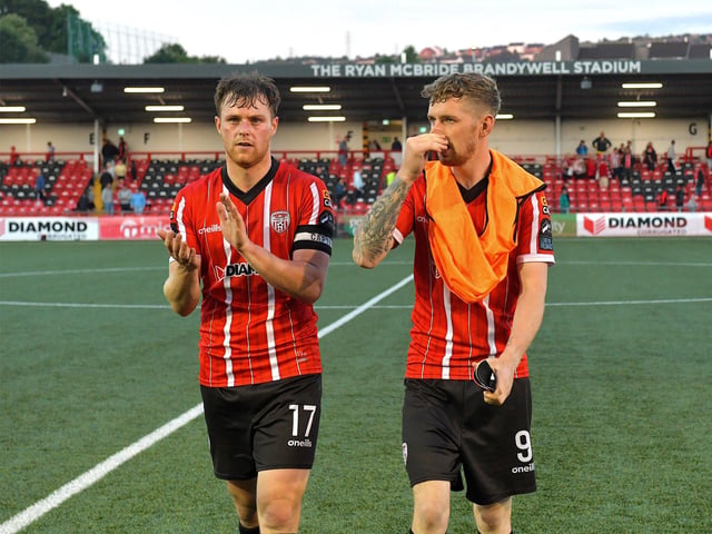 Disappointed Derry City players Cameron McJanett and Jamie McGonigle leave the pitch after the game against Shelbourne on Friday night.  Photo: George Sweeney. DER2321GS - 86
