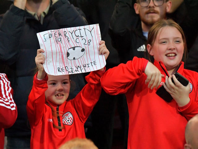 Fans celebrate Derry City’s win over KuPs at the Brandywell. Photo: George Sweeney. DER2330GS -