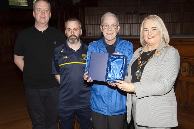 Hen McDaid receiving a presentation from the Mayor, Sandra Duffy in recognition of his long service to Don Boscos FC, at Friday night’s 50th Anniversary Reception in the Guildhall. ON left is Liam McGilloway, club secretary and Marty Crumley, chairperson.