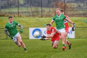 Derry's Gareth McKinless gets off a pass under pressure during Saturday's League opener against Limerick. (Photo: George Sweeney)