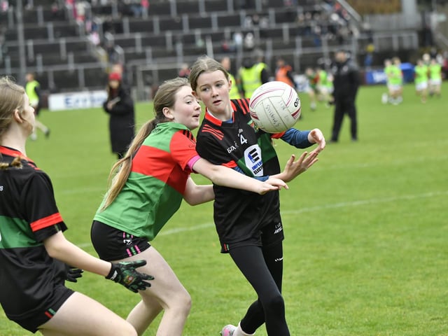Young footballers from Doire Trasna and Slaughtmanus Under 12 teams play at half-time at the Derry Junior Football Championship Final held in Celtic Park on Sunday afternoon. Photo: George Sweeney