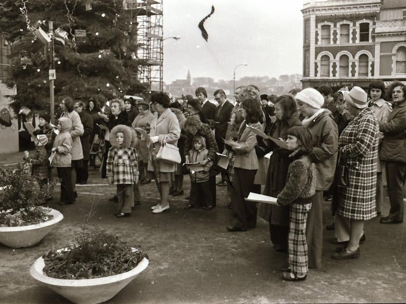 Interdenominational Christmas carols for peace outside the Guildhall in December 1974.