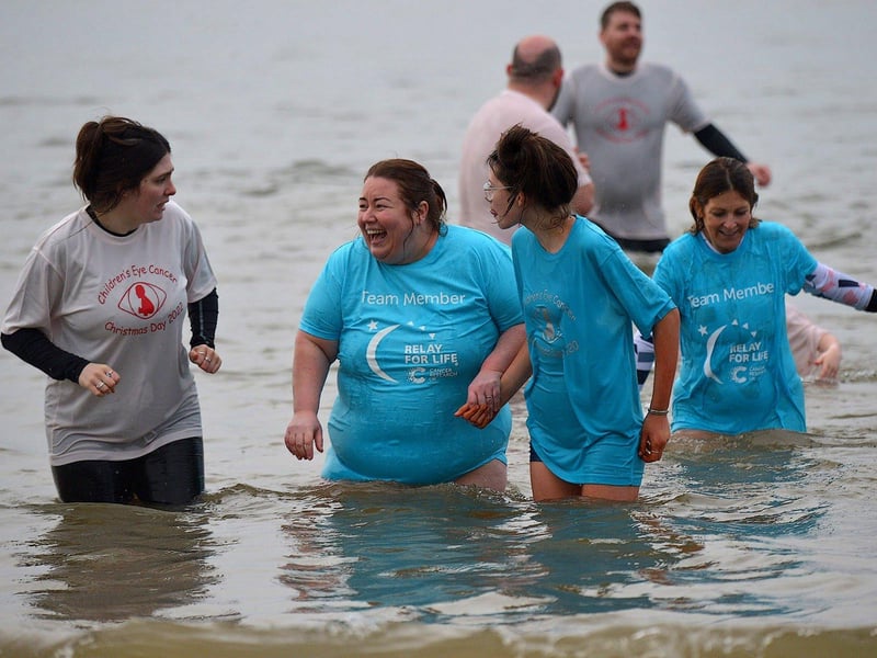 Some of the swimmers who took part in the annual Christmas morning charity swim at Ludden beach. Photo: George Sweeney. DER2252GS – 23