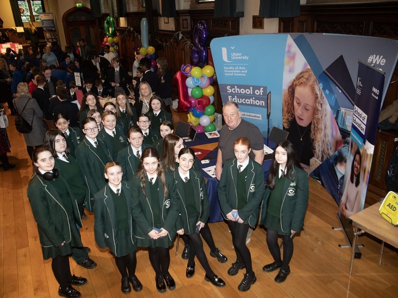 Students from St. Cecilia's College pictured at the Ulster University stall on Friday with Mr. Paul O'Hea. : .